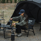 ShineTrip compact folding camping chair used around a campsite while preparing coffee, lightweight folding chair for camping in British Columbia.