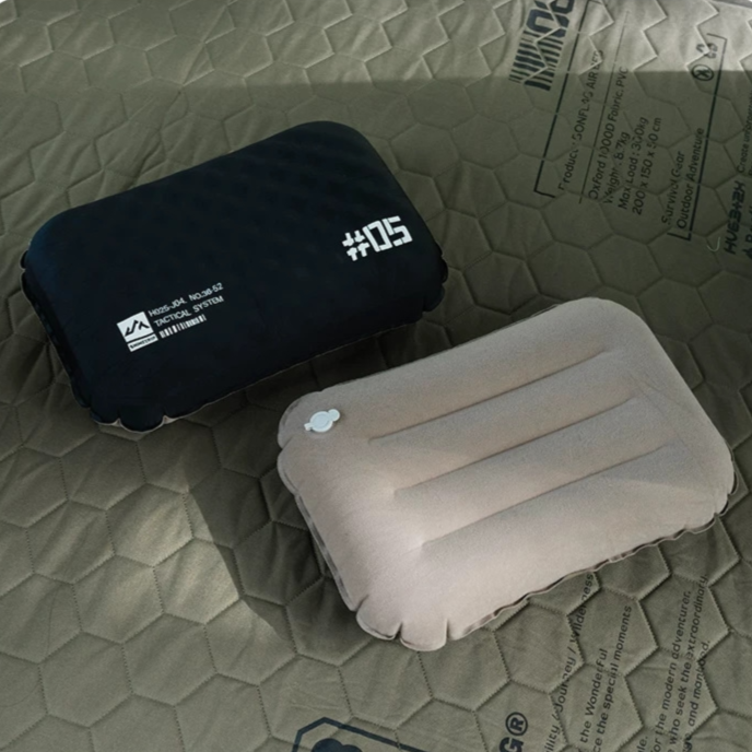 Front and back view of the ShineTrip inflatable camping pillow showing the hybrid memory foam and adjustable air chamber construction for lightweight comfort and ergonomic outdoor support.