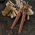 camping fire tongs with leather storage case portable outdoor tool sheaths on a wooden pile with a lantern and gloves in the background.