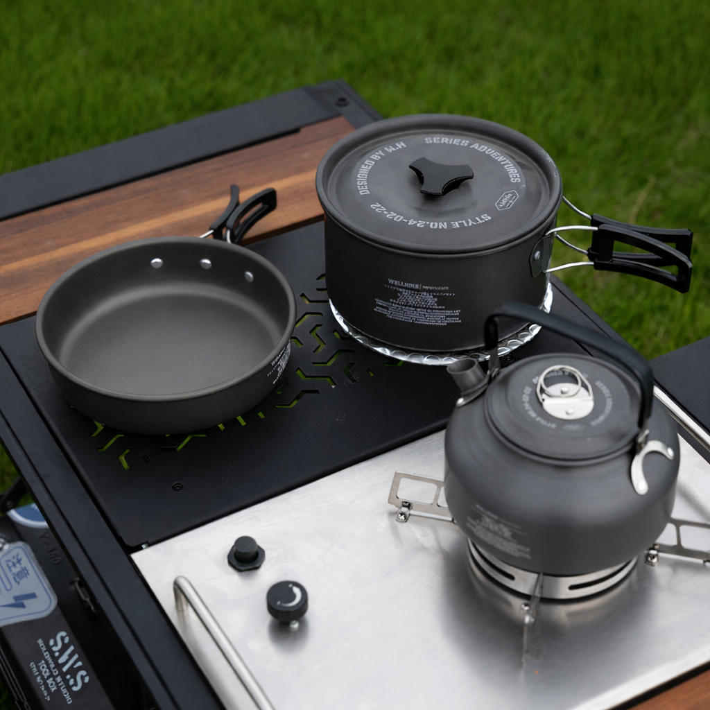 Lightweight aluminum camping cookware set used on a portable camping stove