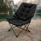 Comfortable padded camping chair placed outdoors near a mountain lake for relaxed seating