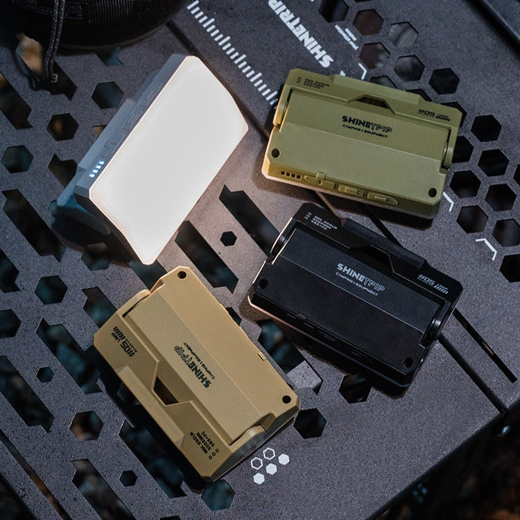 rechargeable card camping light in black, green, sand color display on camping table
